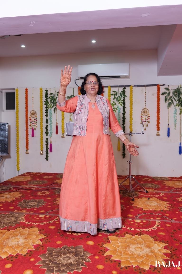 Waving joyfully amid festive marigold decor