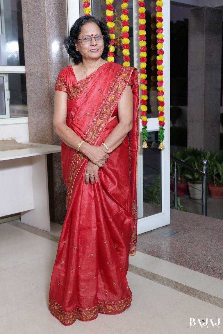 A graceful moment beneath festive floral decor