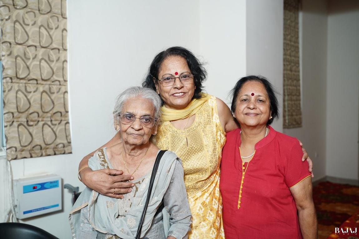 Three generations together in a heartfelt embrace